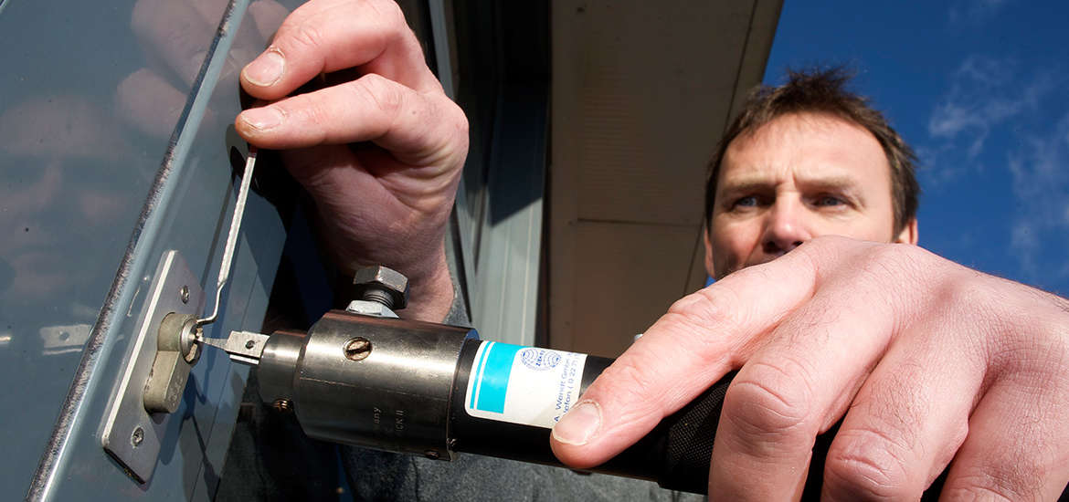 Locksmith working on lock